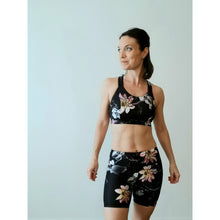Load image into Gallery viewer, Model wearing short leggings and top made both of recycled plastic fabrics
