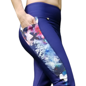 side view of our model on a legging with pocket, navy blue with butterfly stripes