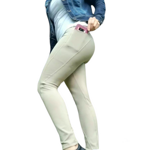 model showing off the beige pocket leggings made out of recycled plastic fabrics