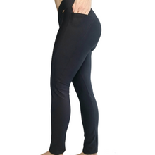 Load image into Gallery viewer, side photo of a model wearing black pocket leggings made out of recycled plastic fabrics

